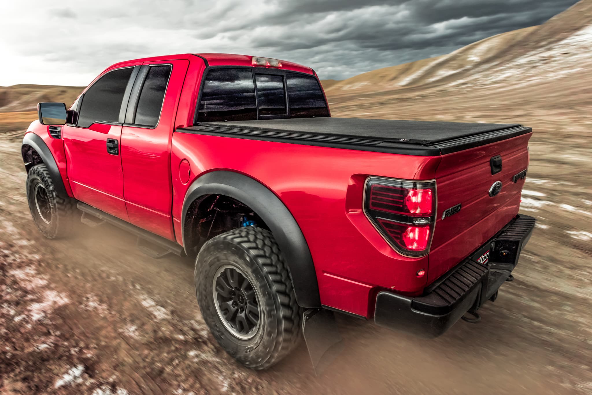 TruXedo Lo Pro on a F150 Ford Raptor driving through the desert